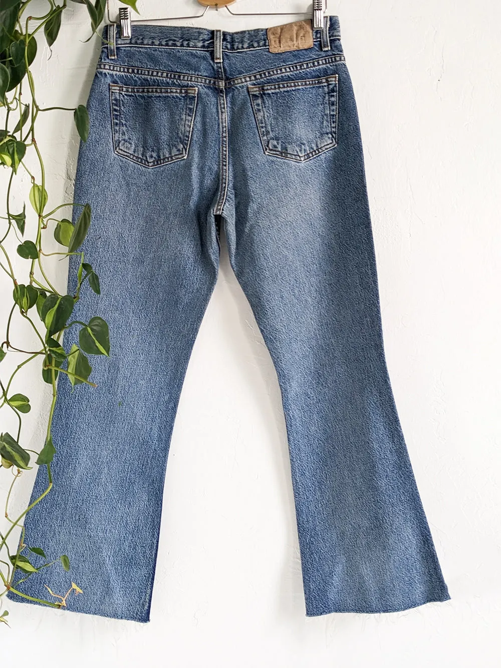 AE Medium Wash Raw Edge Kick Flare Jeans