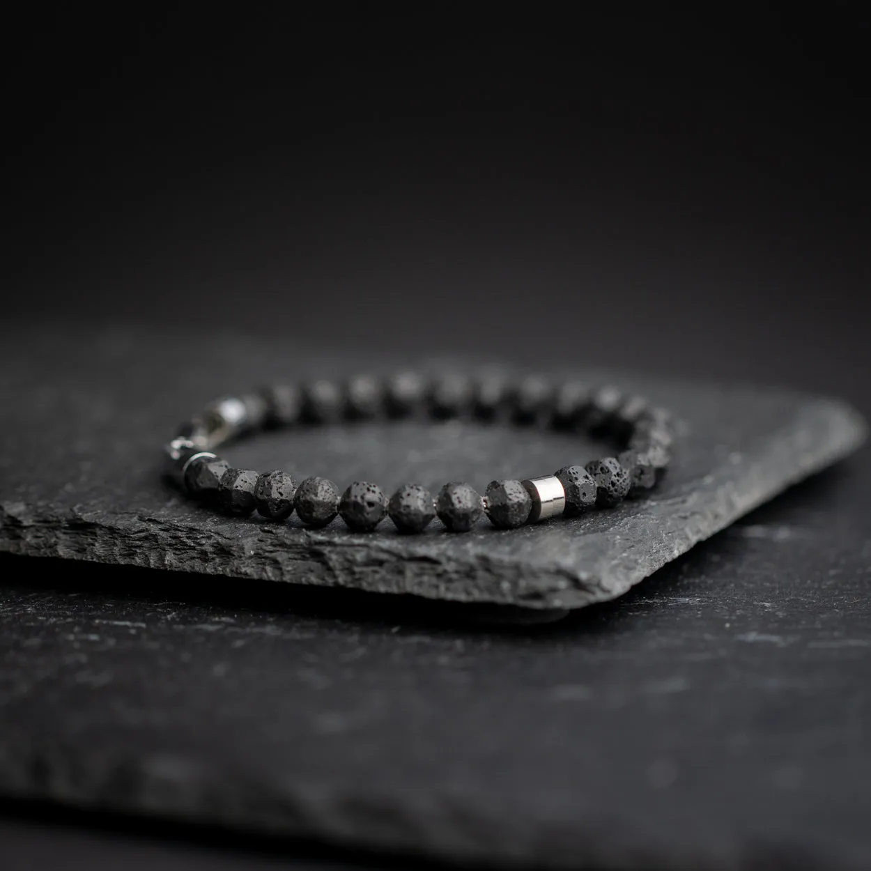 Bracelet with 6mm black Lava stone and titanium element