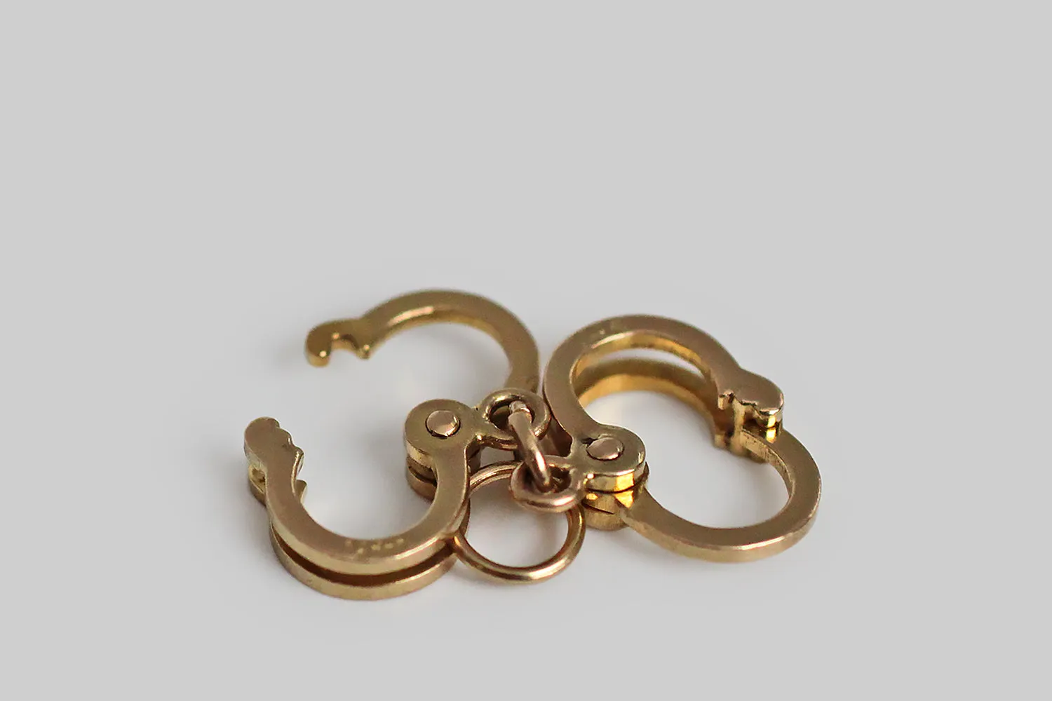 Dainty Mid 20th Century Mechanical Handcuffs Charm in 14k Gold